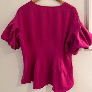 Peplum Top In Fushia With Tailored Seams And Pleated Puff Sleeves